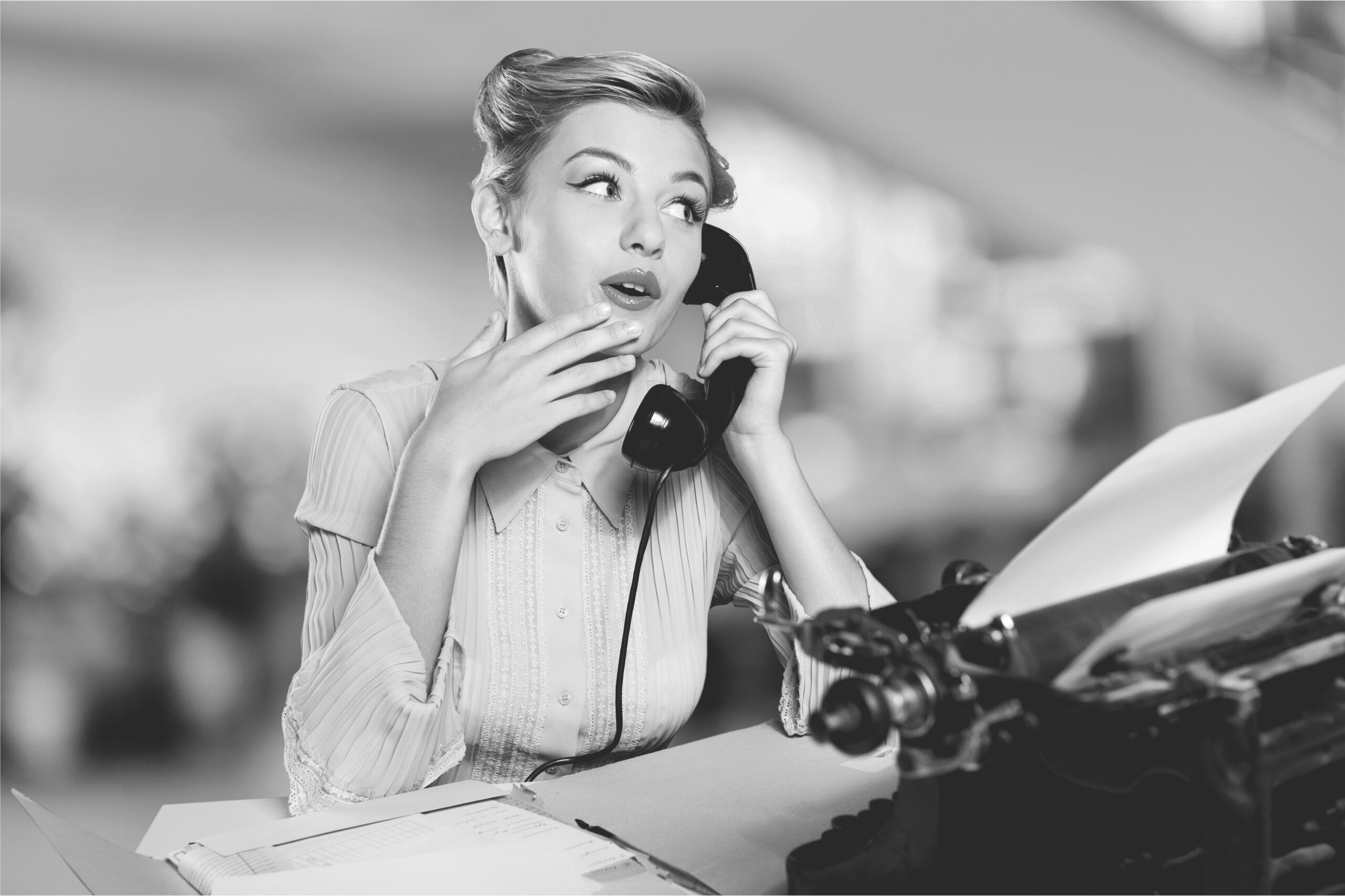 Attractive young woman speaking on  vintage phone